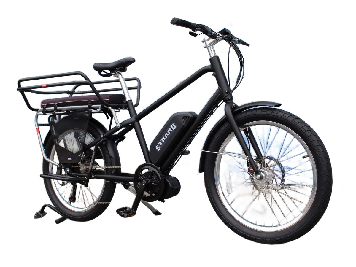 A black Strand cargo e-bike with a rear rack and passenger deck.